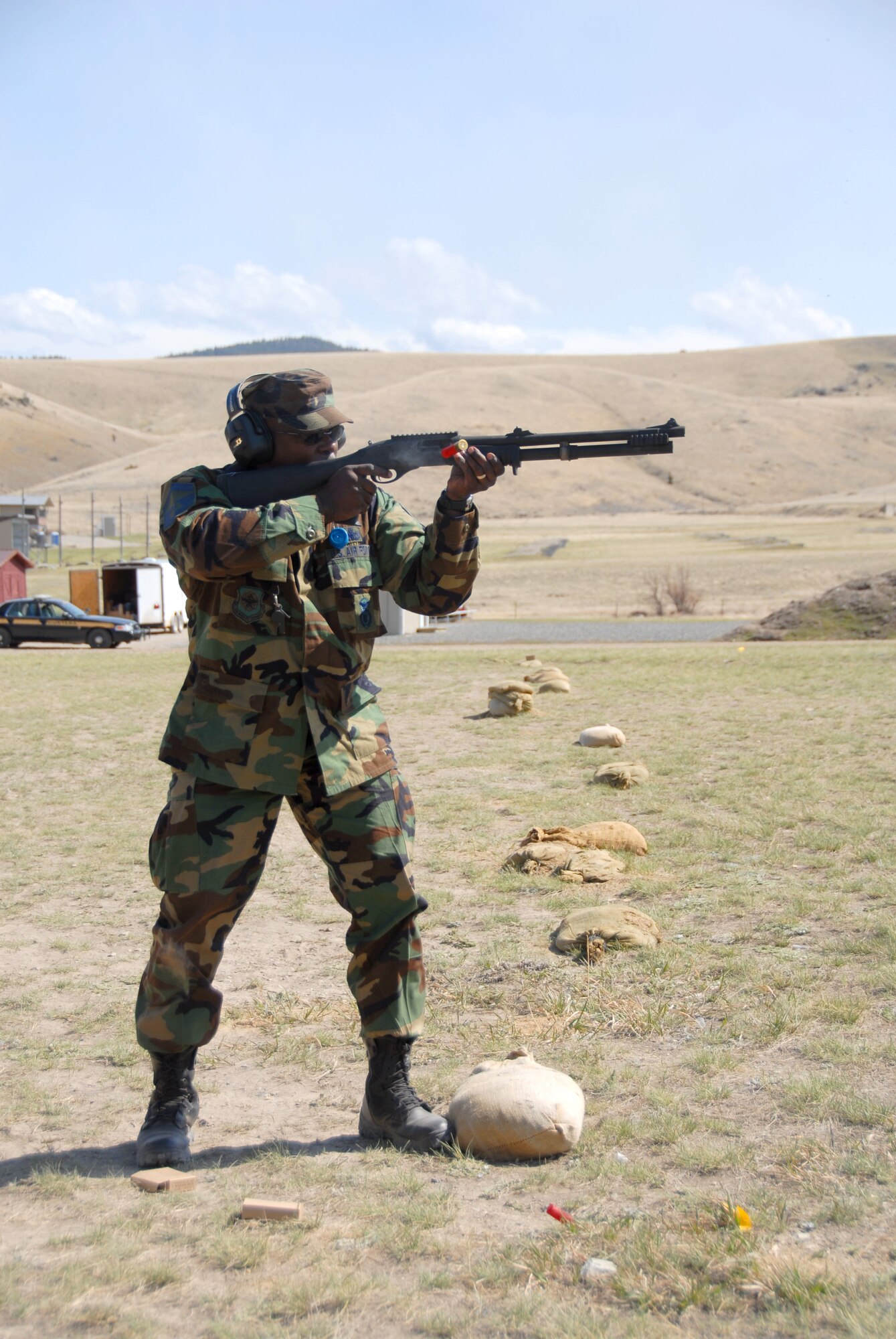A member of the 185th Air Refueling Wing, Security Forces from Sioux City, Iowa, qualifies with the Remington shotgun at Fort Harrison, Montana, on 11 May, 2009.  (U.S. Air Force photo by TSgt. Brian Cox)