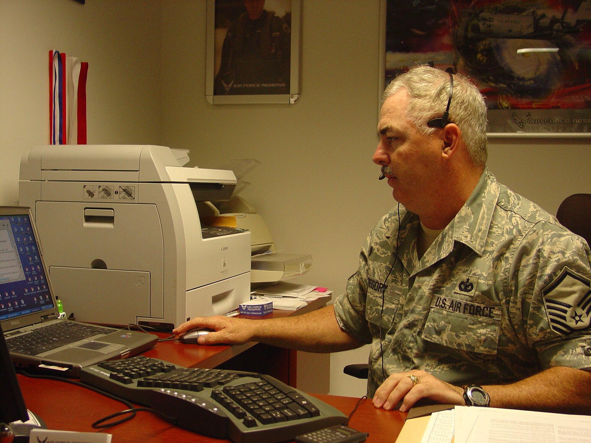 ALTUS AIR FORCE BASE, Okla. -- Master Sgt. Ron Gregory, Altus AFB in-service recruiter, talks to a potential applicant about opportunities available in the Air Force Reserve. Sergeant Gregory guides applicants through the enlistment process and informs those interested in joining the reserves what programs are open to them. (U.S. Air Force photo/Kevin T. Chandler)