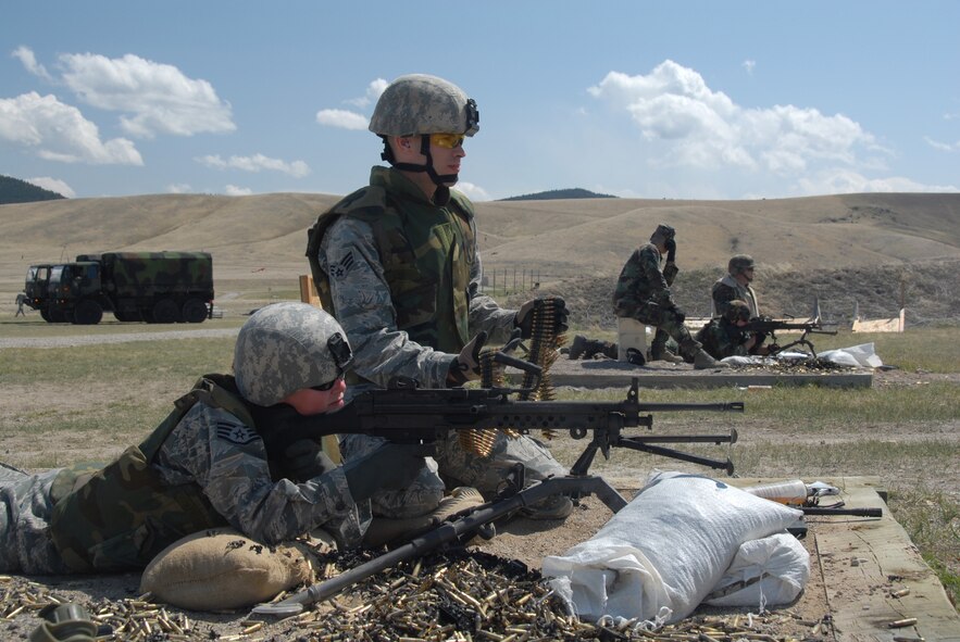 Members of the 185th Air Refueling Wing, Security Forces from Sioux City, Iowa, fire the Squad Automatic Weapon (SAW) M-249 Light Machine Gun at Fort Harrison, Montana, on 11 May, 2009.  (U.S. Air Force photo by TSgt. Brian Cox)