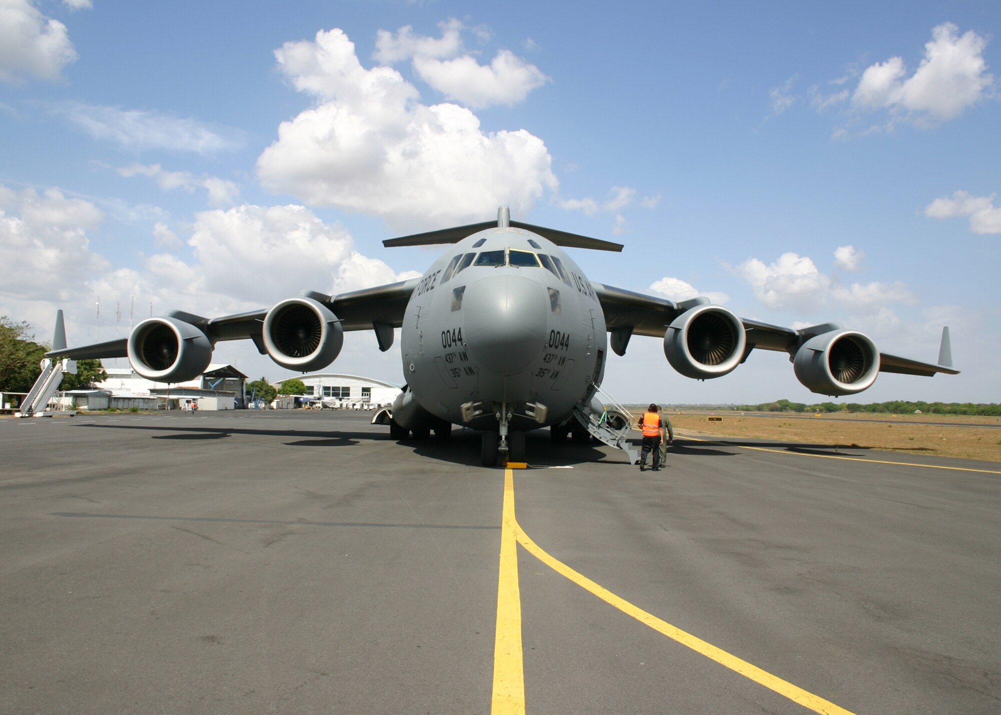 MANAGUA, NICARAGUA – A U.S. Air Force C-17 Globemaster III from the 437th Airlift Wing at Charleston Air Force Base, S.C., sits on the ramp of Managua International Airport May 9, after its crew offloaded cargo during a mission to deliver personal protective kits to help reduce the spread of the H1N1 influenza virus. The kits are part of a U.S. Agency for International Development shipment to Haiti, Guatemala, Honduras, El Salvador, Nicaragua and Belize to help these nations prepare for a potential outbreak of the H1N1 influenza virus. (Photo by Raymond Sarracino, U.S. Southern Command Public Affairs)
