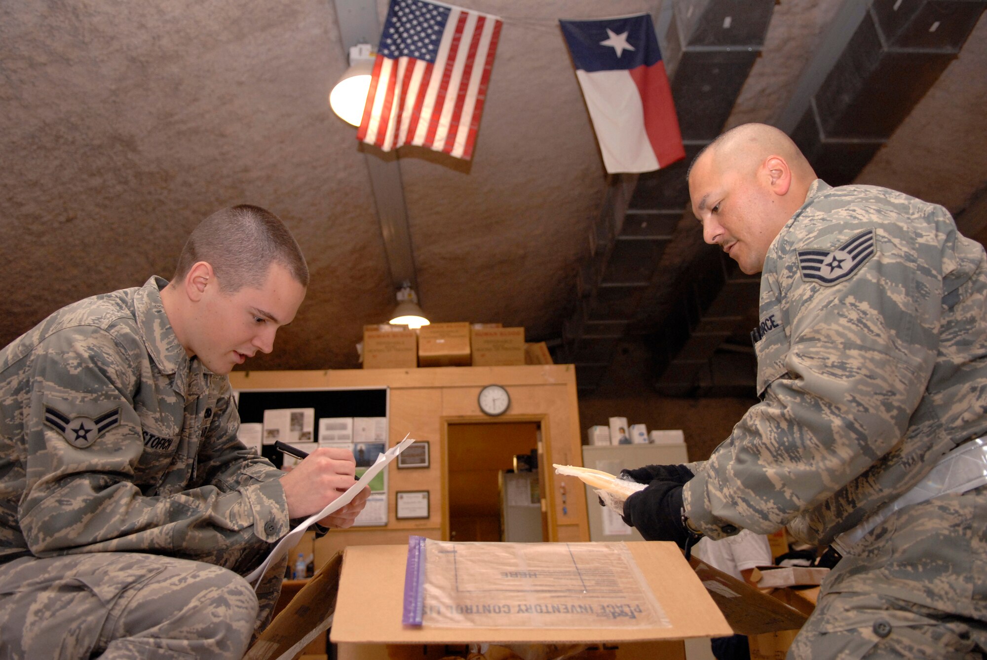 Airman 1st Class Benjamin Cristofich, 71st Expeditionary Air Control Squadron (EACS), inventories frozen plasma with Staff Sgt. James Palapas, also from the 71st EACS, during a volunteer session in the Blood Transshipment Center (BTC), May 9, 2009, at an undisclosed location in Southwest Asia.  The BTC uses a steady stream of volunteers to assist in inventorying incoming blood products and preparing them for distribution throughout the U.S. Central Command's Area of Responsibility.  Airman Cristofich hails from Austin, Texas.  Sergeant Palapas hails from Vallejo, Calif.  Both are deployed from Aviano Air Base, Italy in support of Operations Iraqi and Enduring Freedom and Combined Joint Task Force - Horn of Africa.  (U.S. Air Force photo/Senior Airman Andrew Satran/released)