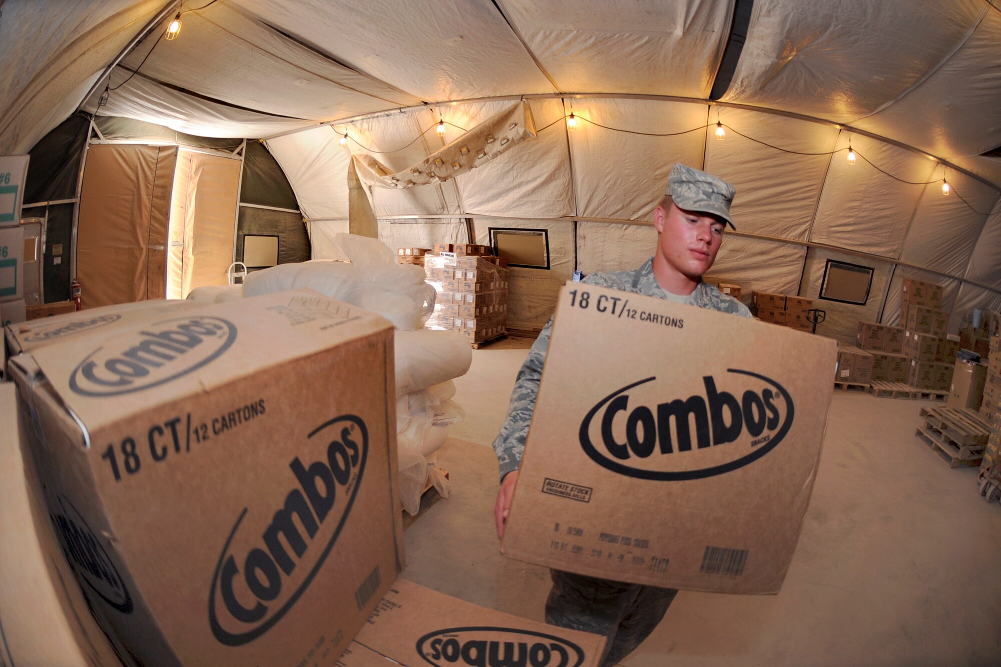 Airman 1st Class Harry Roderick, a food services specialist with the 379th Expeditionary Force Support Squadron, retrieves food from the store room to restock the 'Grab n Go' food facility, May 12, 2009, in an undisclosed location in Southwest Asia.  Airman Roderick and fellow co-workers at the 'Grab n Go' provide a quick stop food source for all base personnel as well as transient personnel who are en-route to the final destinations.  Airman Roderick is native to Little Rock, Ark. and is deployed from the Arkansas Air National Guard in support of Operations Iraqi and Enduring Freedom, and Combined Joint Task Force - Horn of Africa.  (U.S. Air Force Photo by Staff Sgt. Joshua Garcia/released)