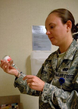 Tech. Sgt. Christina Dodson draws up medication at the Charleston AFB clinic May 11. Sergeant Dodson supervises a team consisting of a doctor, physician assistant, two nurses and two medical technicians who provide patient care to over 1,000 patients monthly. Sergeant Dodson is a medical technician with the 437th Medical Group. (U.S. Air Force photo/Senior Airman Katie Gieratz)