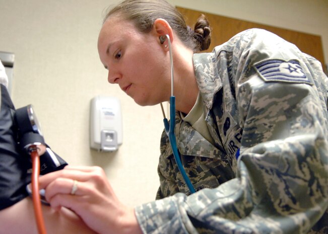 Technical Sgt. Christina Dodson checks a patients blood pressure at the Charleston AFB clinic May 11. During the first quarter of 2009 she assisted in providing in-house care to 13,085 patients. Sergeant Dodson is a medical technician with the 437th Medical Group. (U.S. Air Force photo/Senior Airman Katie Gieratz)