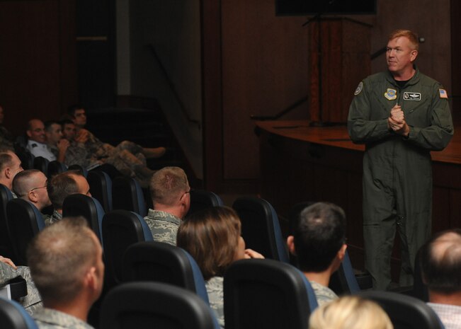 Col. Tom Freese addresses Team Charleston members at the base theater May 11. The chief and his team who were from different locations were welcomed with cheers from the various units' representatives at the theater. Colonel Freese is the chief of the inspections division for the office of the inspector general. (U.S. Air Force Photo/Senior Airman Katie Gieratz)