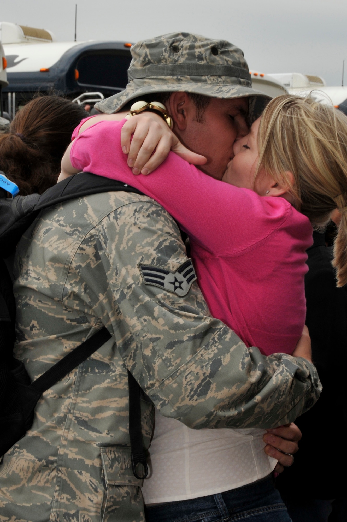 ROYAL AIR FORCE LAKENHEATH, England -- Sarah Garner gives her husband, Senior Airman Richard Garner, 48th Munitions Squadron, a welcome home kiss May 13, 2009. Over 250 Airmen returned from a four month deployment to Afghanistan in support of Operation Enduring Freedom. (U.S. Air Force photo by Airman 1st Class Perry Aston) 
