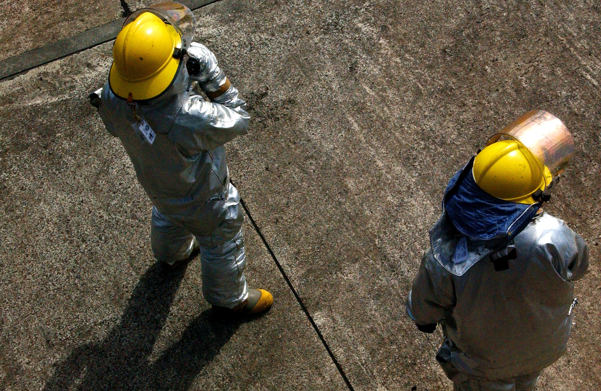 Firefighters from the 18th Civil Engineer Squadron radio in for assistance to carry the simulated injured victims to a field treatment team for critical care during Beverly High 09-2 Local Operational Readiness Exercise May 12. The LORE tests base personnel on their combat readiness for real world emergency/combat events.
(U.S. Air Force photo/Tech. Sgt. Rey Ramon) 