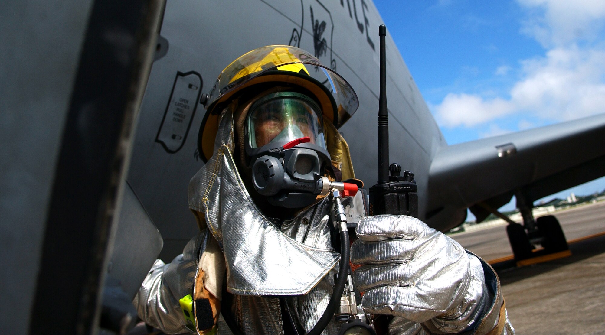 A local national firefighter from the 18th Civil Engineer Squadron radios in for assistance with the simulated injured aircrew during Beverly High 09-2 Local Operational Readiness Exercise May 12. The LORE tests base personnel on their combat readiness for real world emergency/combat events.
(U.S. Air Force photo/Tech. Sgt. Rey Ramon) 
