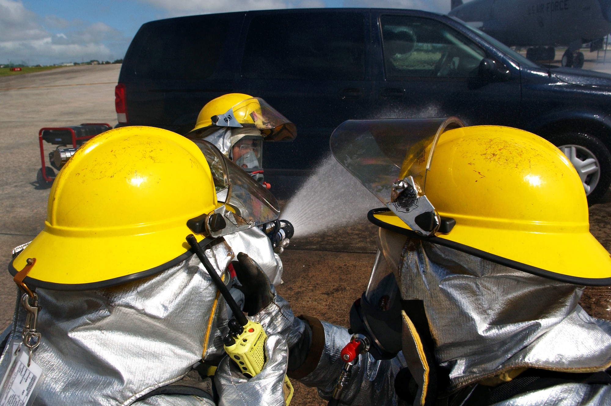 Firefighters from the 18th Civil Engineer Squadron extinguish a simulated burning vehicle before rescuing the victim during Beverly High 09-2 Local Operational Readiness Exercise May 12. The LORE tests base personnel on their combat readiness for real world emergency/combat events.
(U.S. Air Force photo/Tech. Sgt. Rey Ramon) 