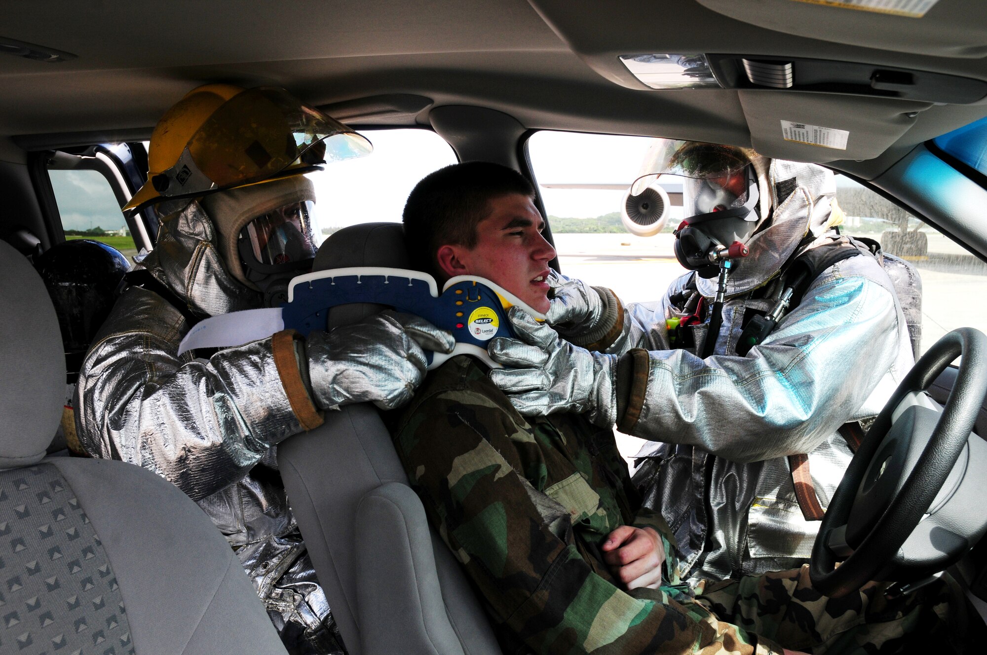 Firefighters from the 18th Civil Engineer Squadron rescue a victim from a simulated burning vehicle during Beverly High 09-2 Local Operational Readiness Exercise May 12. The LORE tests base personnel on their combat readiness for real world emergency/combat events.
(U.S. Air Force photo/Airman 1st Class Amanda Grabiec) 