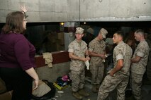 Marines from 1st Marine Division and 2nd battalion 24th Marines receive their final instructions before beginning the process of cleaning out the Cornerstone Community Center's basement May 13. The volunteer effort was a part of the first ever Marine Week held in Chicago.