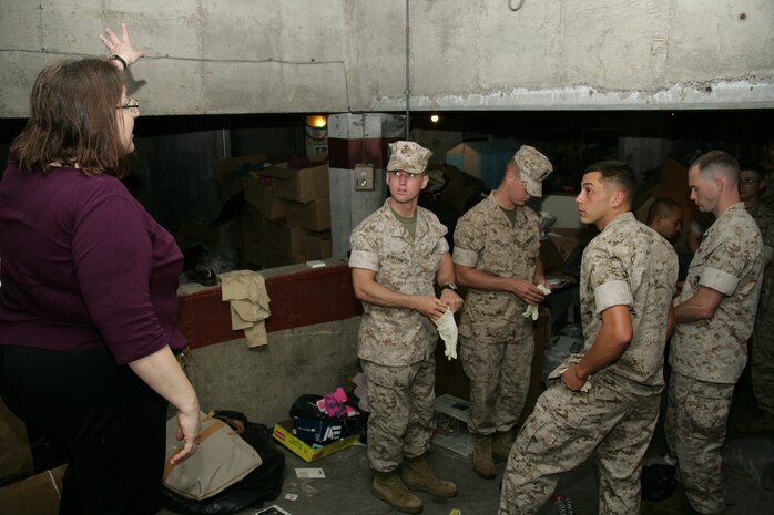 Marines from 1st Marine Division and 2nd battalion 24th Marines receive their final instructions before beginning the process of cleaning out the Cornerstone Community Center's basement May 13. The volunteer effort was a part of the first ever Marine Week held in Chicago.