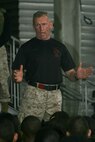- Retired Marine LtCol. Joseph Shusko, Director of the Marine Corps’ Martial Arts Center of Excellence (MACE) talks with a group of 800 cadets from the Junior Reserve Officers’ Training Corps during a demonstration of martial arts maneuvers by members of