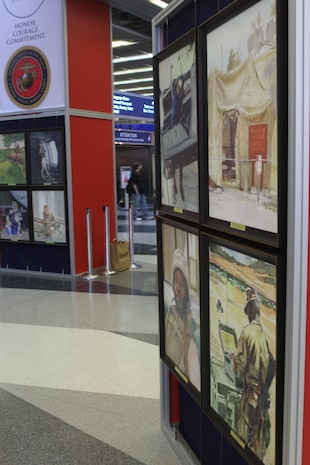 Combat illustrations are posted as part of a traveling display located at Chicago O'Hare International Airport from the National Museum of the Marine Corps located at Quantico, Va., May 13, 2009. The exhibit was placed in the airport's high traffic areas as part of an informative and interactive part of Marine Week Chicago. (U.S. Marine Corps photo by Cpl. Seth Maggard/Released)