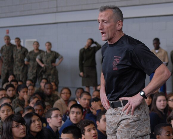 Retired Lt. Col. Joseph C. Shusko, director, Martial Arts Center of Excellence, Quantico, VA.., speaks with the crowd of spectators about the different techniques used in the Marine Corps Martial Arts Program May 13 at Soldier Field. MCMAP is the hand-to-hand combat program used by the Marine Corps today.