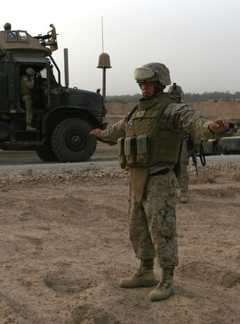 Sgt. Anthony R. Tripp, a platoon sergeant with Security Company, 2nd Supply Battalion, 2nd Marine Logistics Group (Forward), plays the role of a lost Marine who has just been found by a convoy, during an immediate action training exercise, May 14, 2009, aboard Camp Al Taqaddum, Iraq.  The monthly exercise tested the Marines' immediate action skills during three scenarios; finding a lost Marine, searching for a possible improvised explosive device, and reacting to an explosion that resulted in casualties.