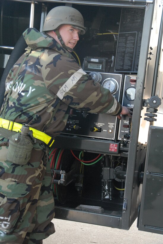 Staff Sgt. Eric Beckemeier, 442nd Logistics Readiness Squadron, monitors a refueling operation while servicing an A-10 Thunderbolt II during an Operational Readiness Exercise at Whiteman Air Force Base, Mo., May 14, 2009. The 442nd LRS is part of the 442nd Fighter Wing, an Air Force Reserve Command A-10 unit. (US Air Force photo/Master Sgt. Bill Huntington)