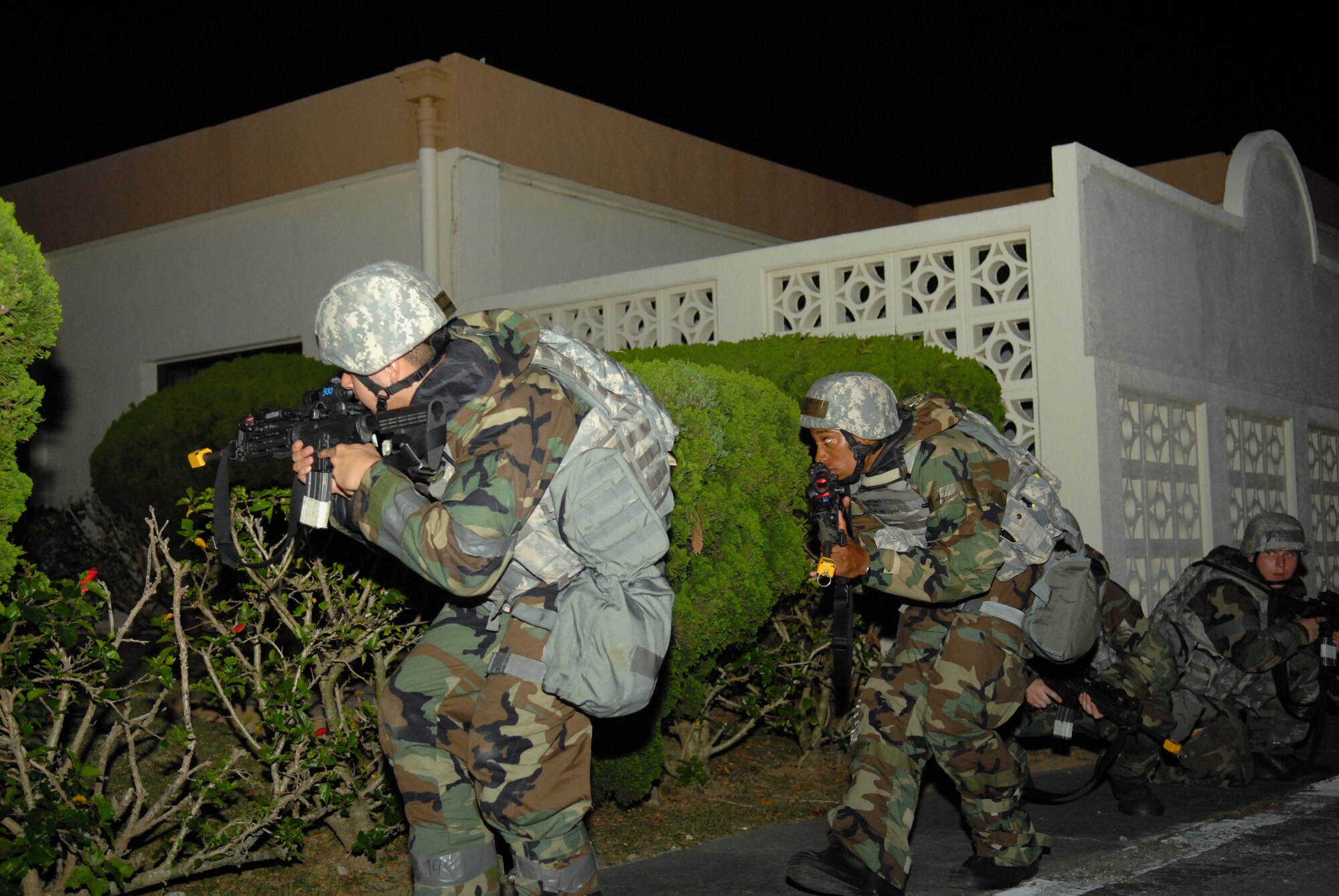 Members of the 18th Security Forces Squadron secure the area while responding to a simulated mortar attack during Beverly High 09-2 Local Operational Readiness Exercise at Kadena Air Base, May 14. The LORE tests base personnel on their combat readiness for real world emergency/combat events.
(U.S. Air Force photo/Tech. Sgt. Angelique Perez) 