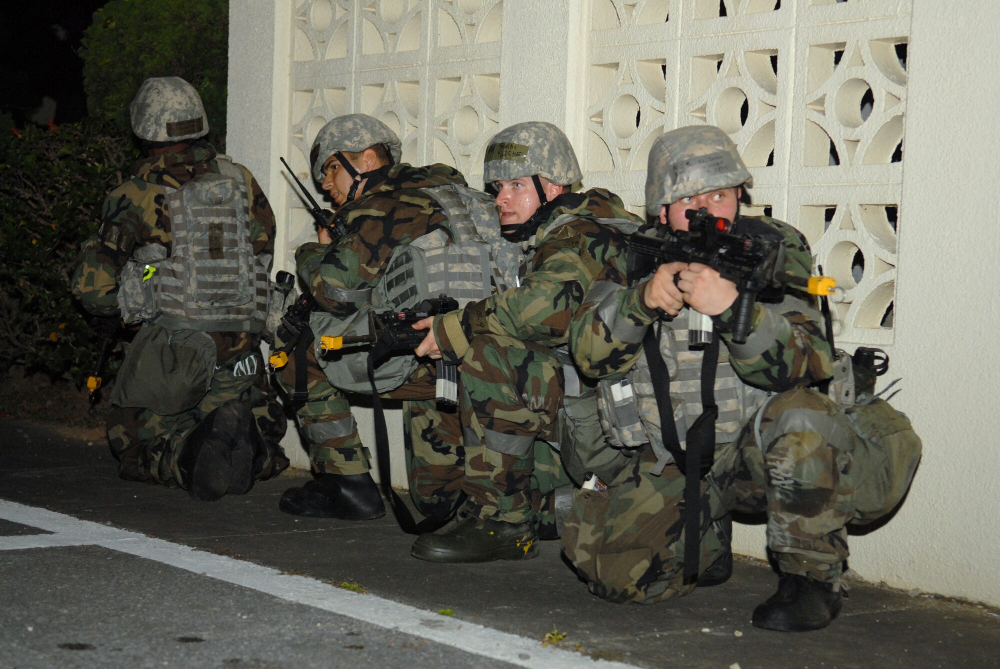 Members of the 18th Security Forces Squadron secure the area while responding to a simulated mortar attack during Beverly High 09-2 Local Operational Readiness Exercise at Kadena Air Base, May 14. The LORE tests base personnel on their combat readiness for real world emergency/combat events.
(U.S. Air Force Photo/Tech. Sgt. Angelique Perez) 