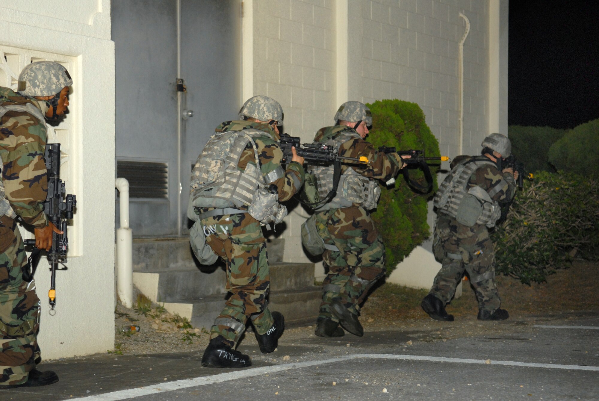 Members of the 18th Security Forces Squadron secure the area while responding to a simulated mortar attack during Beverly High 09-2 Local Operational Readiness Exercise at Kadena Air Base, May 14. The LORE tests base personnel on their combat readiness for real world emergency/combat events.
(U.S. Air Force Photo/Tech. Sgt. Angelique Perez) 
