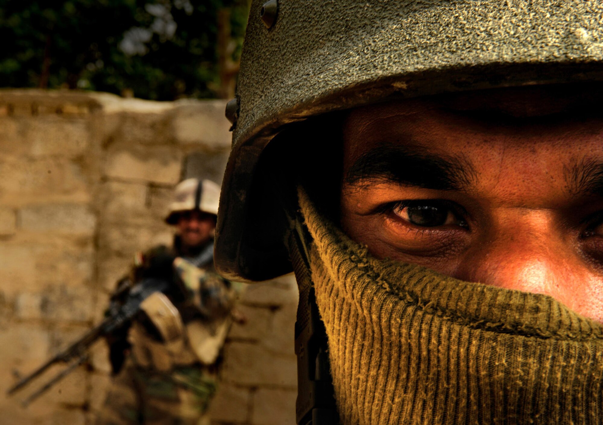 The Stacy Pearsall Combat Photo Gallery — A Military Photographer of the Year, Pearsall’s work has been viewed worldwide. A soldier from the Iraqi army provides security during a foot patrol in Baqubah, Iraq, on Mar. 30, 2007. (photo by Staff Sgt. Stacy Pearsall)