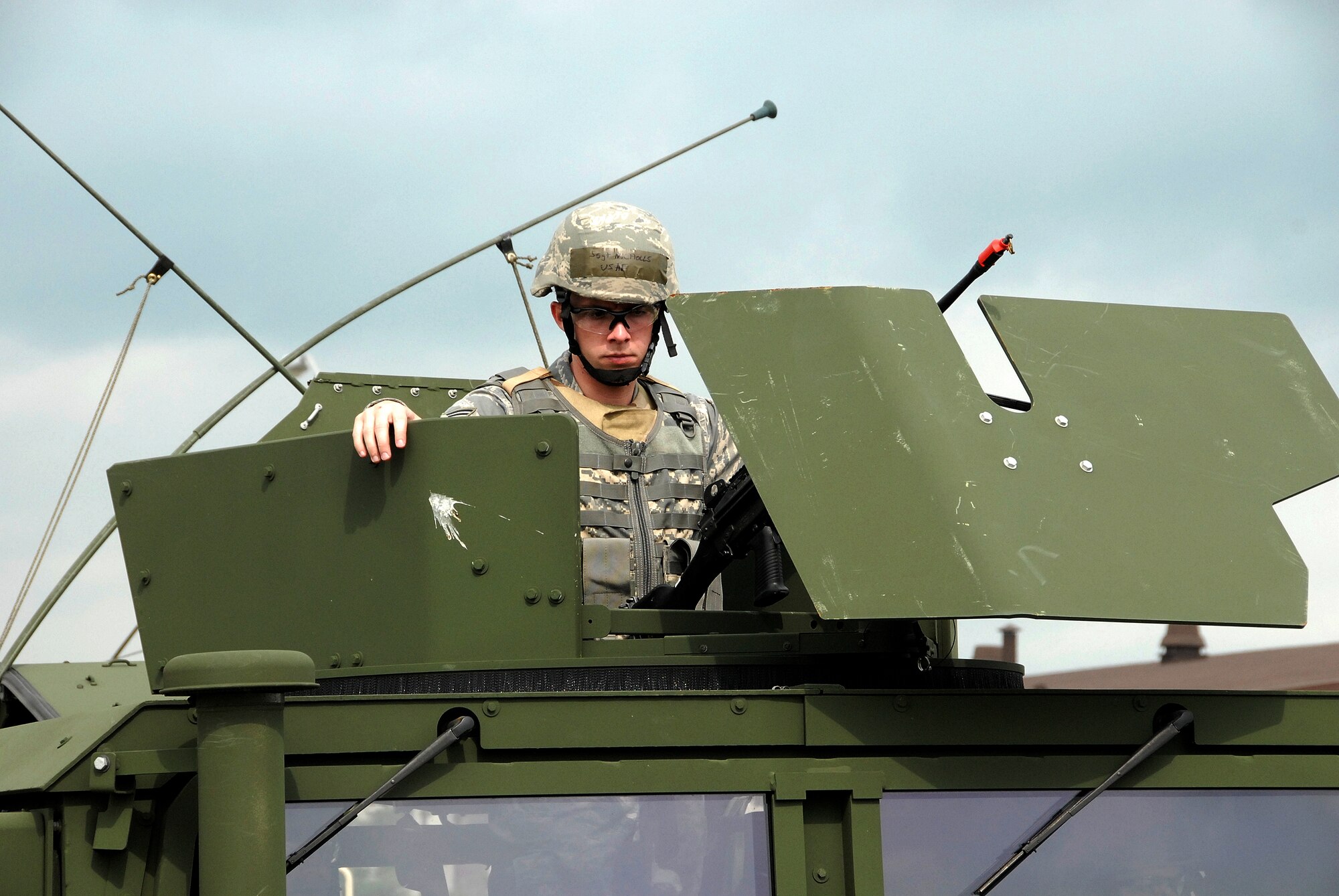 Staff Sgt. Jacob Nicholls, 442nd Security Forces Squadron, mans the turret of a Humvee as his convoy prepares to roll out during an Operational Readiness Exercise at Whiteman Air Force Base, Mo. The 442nd SFS is part of the 442nd Fighter Wing, an Air Force Reserve Command A-10 Thunderbolt II unit. (US Air Foce photo/Staff Sgt. Kent Kagarise)