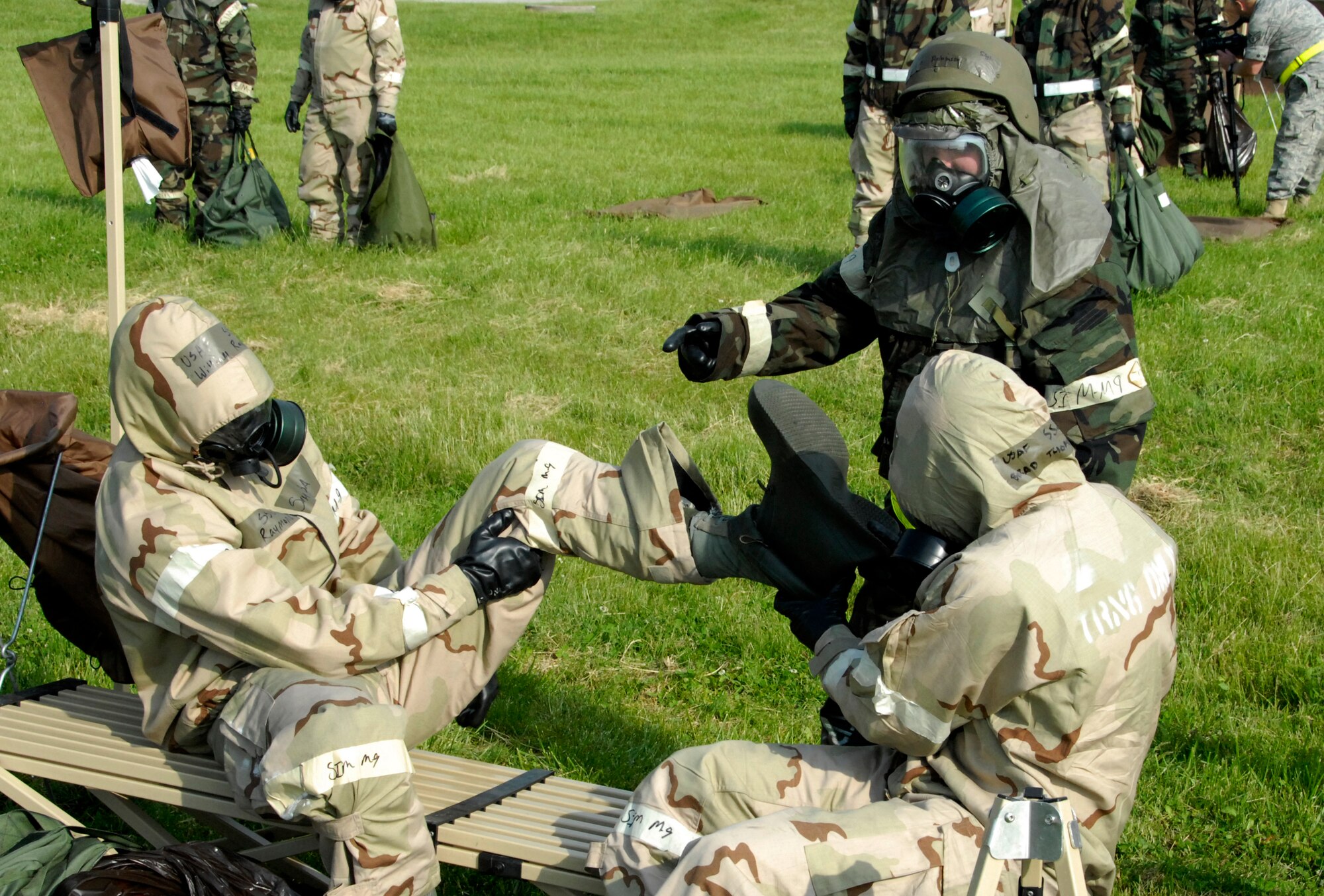 Staff Sgt. Tory Robinson, 442nd Maintenance Operations Flight, directs Staff Sgts. William Raymond and  Brad Thompson, 442nd Operations Group, through chemical-weapons decontamination procedures during an Operational Readiness Exercise at Whiteman Air Force Base, Mo, May 13, 2009. The 442nd MOF and the 442nd OG are part of the 442nd Fighter Wing, an Air Force Reserve Command A-10 Thunderbolt II unit. (U.S. Air Foce photo/Tech. Sgt. John Vertreese)
