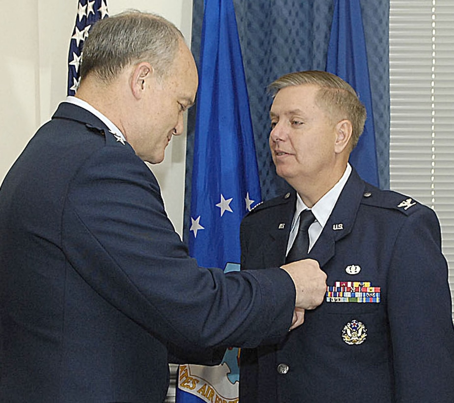 Lt. Gen. Jack L. Rives, Air Force judge advocate general, pins the Meritorious Service Medal on Col. Lindsey Graham in a Pentagon ceremony April 28, 2009. In addition to being a U.S. senator from South Carolina, Colonel Graham is an individual mobilization augmentee and the senior instructor at the Air Force JAG School at Maxwell Air Force Base, Ala. (U.S. Air Force photo)

