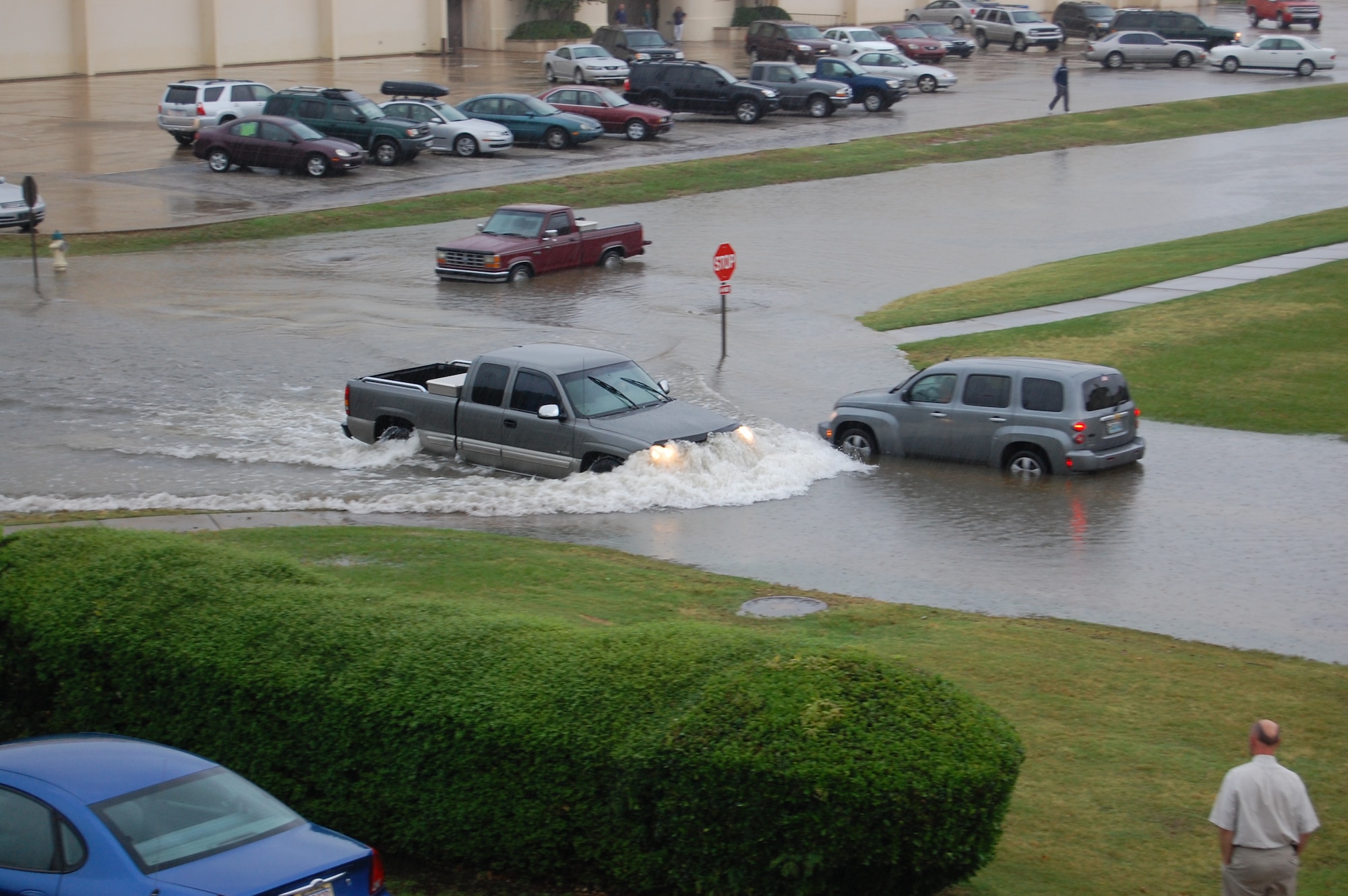 During heavy rains that caused flooding to Maxwell and Gunter May 7, two vehicles stalled at the corner of Ash Street and LeMay Plaza at Maxwell while a larger pickup truck forges ahead through the intersection. Base weather station personnel reported Maxwell received 3.92 inches of rain during the storm. They said the thunderstorm resulted in the worst flooding to the base since Tropical Storm Ivan came through the area in 2004. (U.S. Air Force photo/Carl Bergquist)