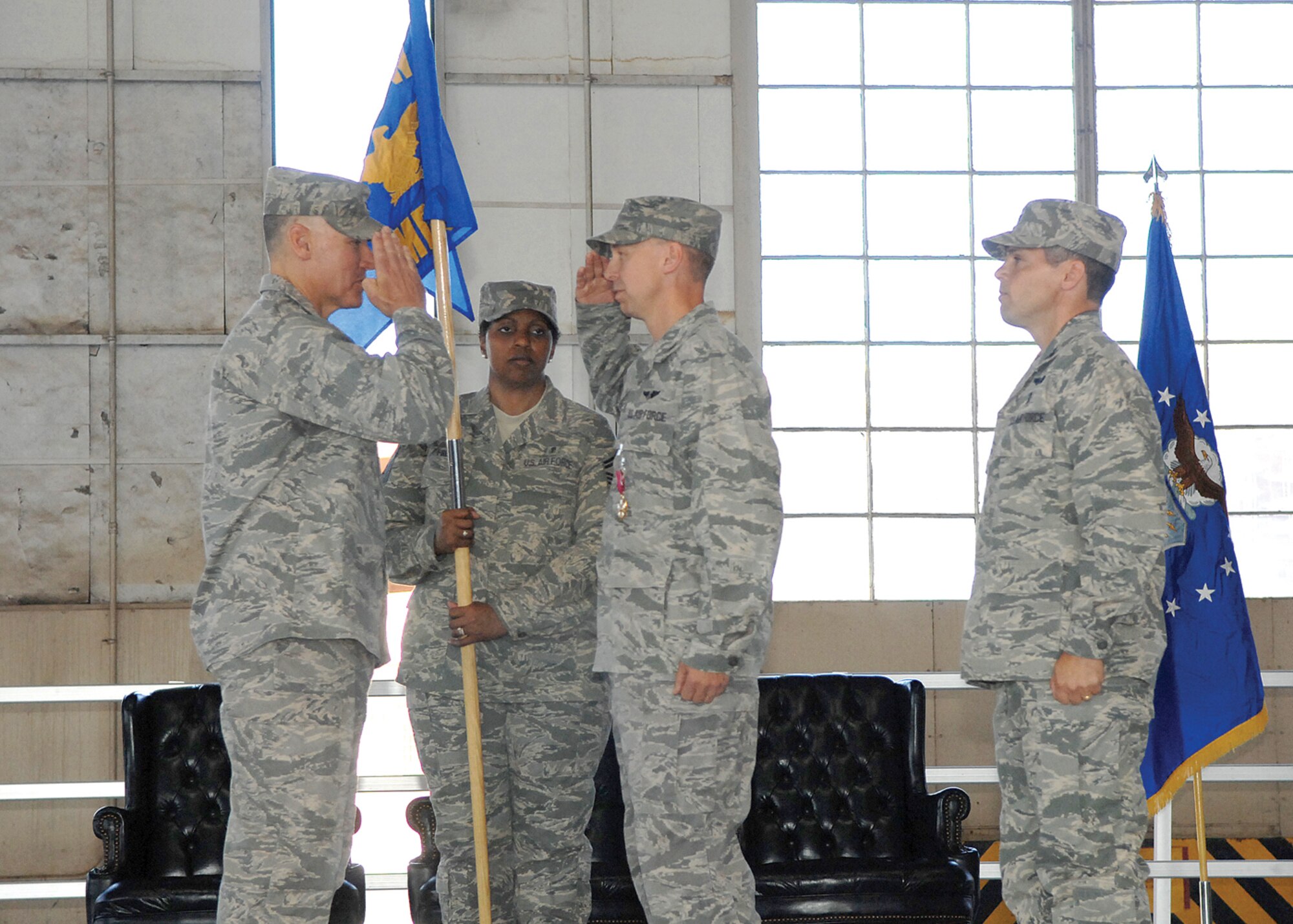 Brig. Gen. Kurt Neubauer salutes Col. Mark Holland, 56th Medical Group commander, in a change of command ceremony held here Monday. Colonel Holland, former Air Education and Training Command Nursing Services Division chief, took over command of the 56th MDG during the ceremony. (U.S. Air Force photo/Tech. Sgt. Jeffrey Wolfe)