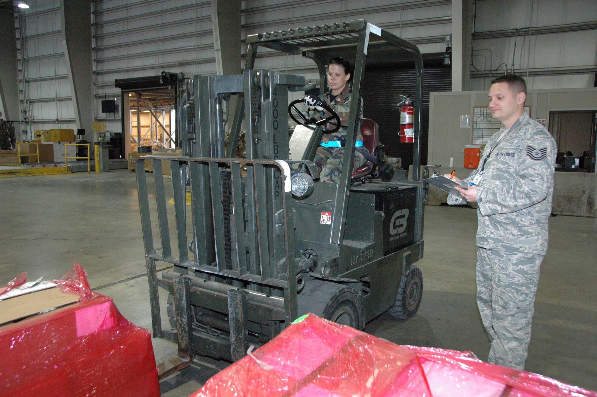 MCGUIRE AIR FORCE BASE, N.J. -- Senior Airman Christen Haldeman an air transportation cargo specialist demonstrates her skill as a forklift operator as Logistics Standardization and Evaluation Program inspector, Technical Sgt. Torramce Williams observes during the recent LSEP held here. (U.S. Air Force photo/Master Sgt. Donna T. Jeffries)