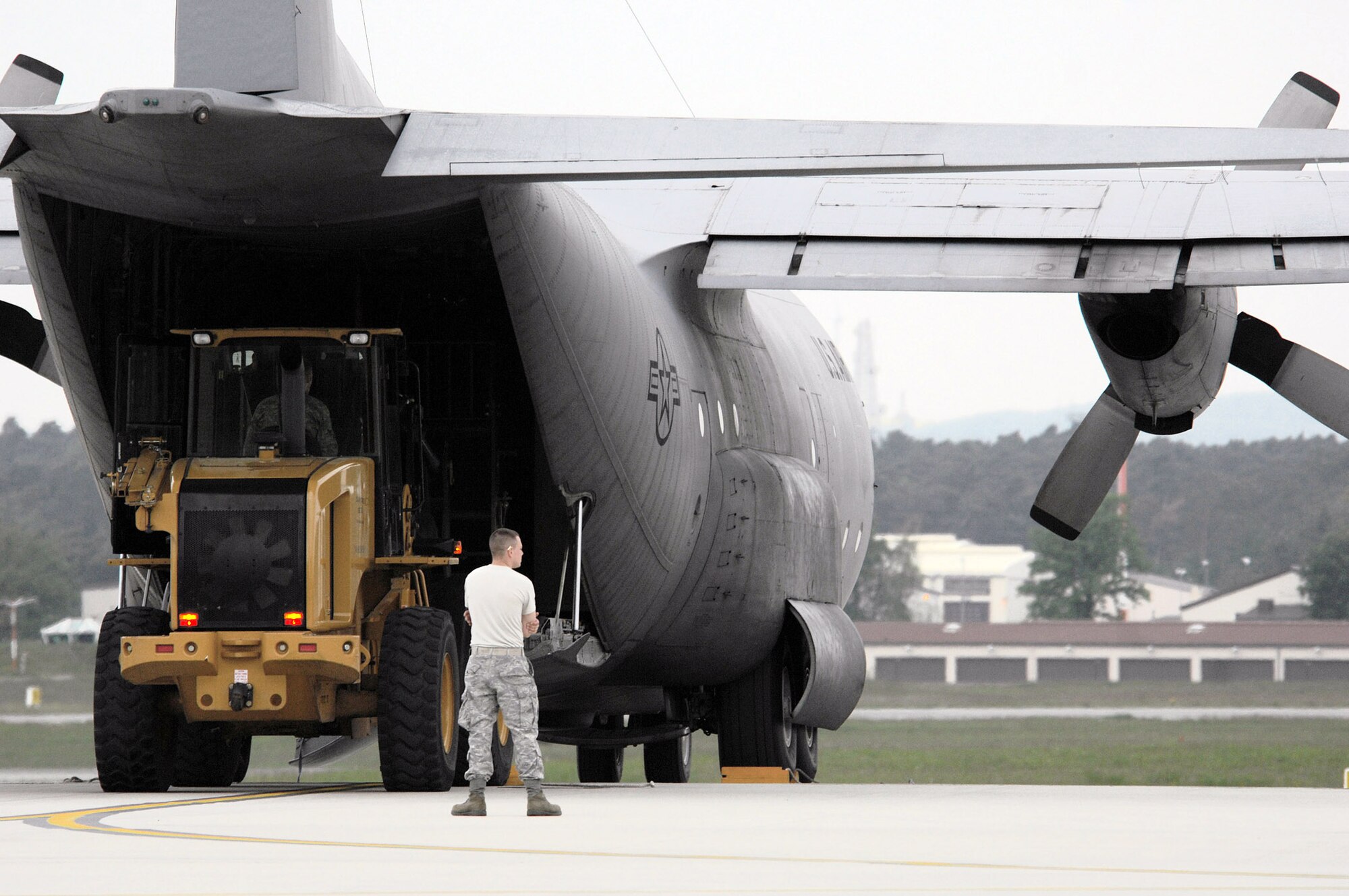 1st Combat Communication Squadron Airmen prepare to loadlife saving equipment onto a C-130 Hercules May 9 at Ramstein Air Base, Germany. The Airmen supported NASA's launch of Space Shuttle Atlantis May 11. (U.S. Air Force photo/Senior Airman Kenny Holston)