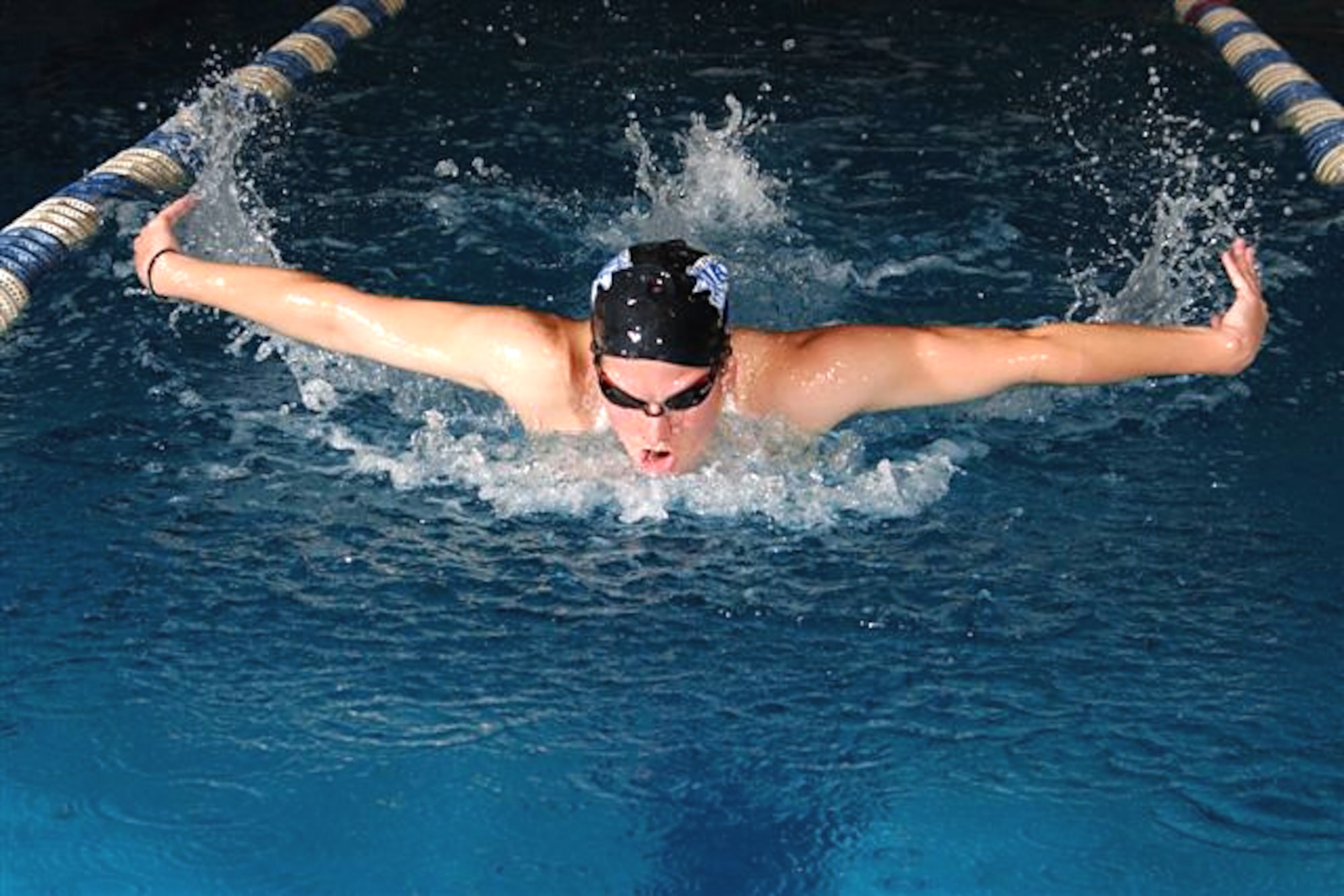 Second Lt. Lindsey Kirchhoff, 4th Aircraft Maintenance Squadron section commander, swims during a 2006 team practice at the Air Force Academy in Colorado Springs, Colo. Lieutenant Kirchhoff led the Air Force women's team to victory against counterparts from NATO countries in the Allied Air Component Command swimming competition in Zakopane, Poland, April 16, 2009. (U.S. Air Force photo by Danny Meyer)