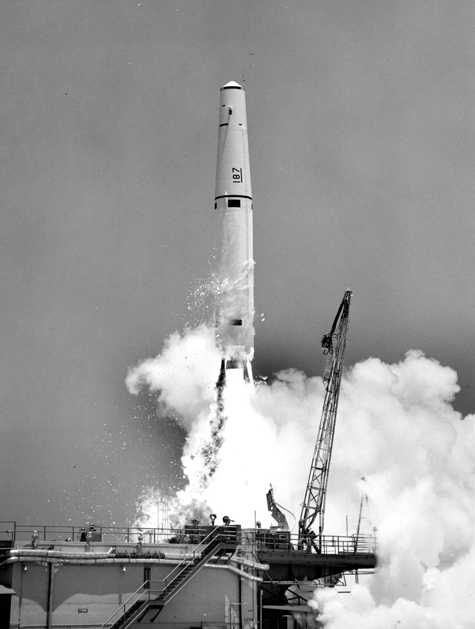 A test Thor takes flight at Cape Canaveral, Fla., on Dec. 5, 1959. The small particles falling away from the rocket are ice formed from frozen condensation on the outside of the chilled liquid oxygen tank. (U.S. Air Force photo)
