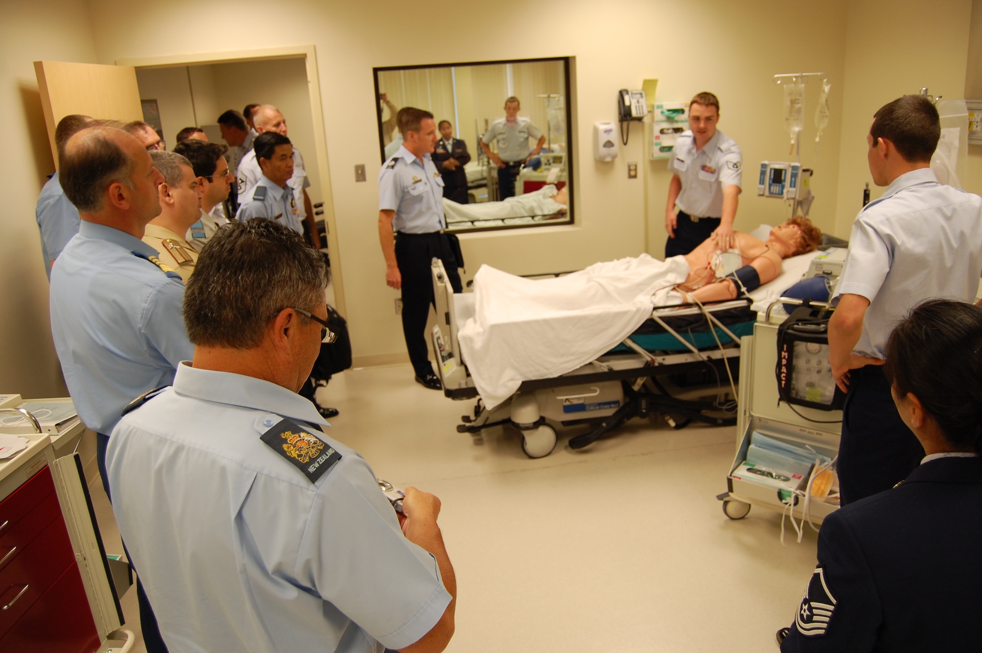 Staff Sgt. Joshua Lowe, 81st Medical Group education and training flight, explains the operation of a patient simulator in the flight’s simulation and skills laboratory to a group of senior enlisted leaders from several foreign military services, Air Force major commands and numbered air forces Monday.  The group visited Keesler Medical Center to learn how the medical group administers Phase II training.  (U.S. Air Force photo by Steve Pivnick)
