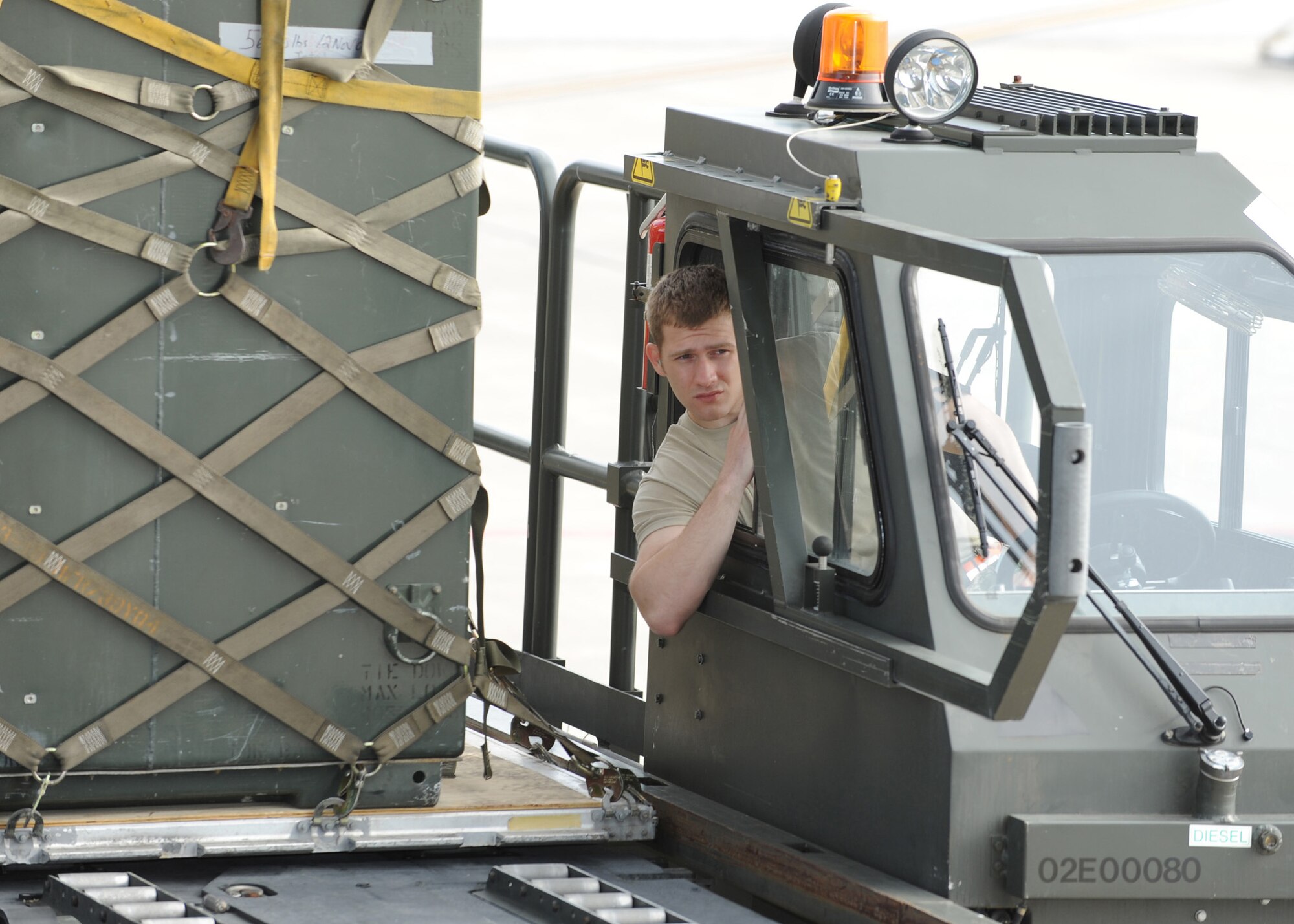 SCOTT AIR FORCE BASE, Ill. -- Senior Airman Keith Wilcox, 375th Logistics Readiness Squadron passenger services representative, offloads pallets onto a C-17 Globemaster III at Scott Air Force Base, Ill. May 12. The cargo will be flown to Volk Field, Wisc., where 375th Airlift Wing Airmen will train with the Minnesota Air National Guard 133rd Airlift Wing and the 94th Arial Port Squadron (Reserve) from Robins Air Force Base, Ga. in preparation for the wing's for the operational readiness inspection in March 2010.  (U.S. Air Force photo/Staff Sgt. Paul Villanueva II)