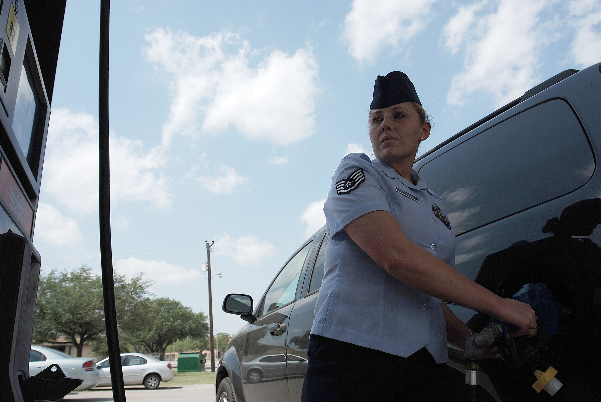 Refueling her flight's government vehicle is one of the many tasks Staff Sergeant Amanda Stephens, a knowledge operations manager for the 710th Information Operations Flight, a Reserve unit at Brooks City-Base, Texas, performs with a smile. The 433rd Airlift Wing provides medical support and mission-essential training for the 710th IOF and Sergeant Stephens is the one who keeps  the unit organized and ready. (U.S. Air Force Photo/Airman Brian McGloin)
