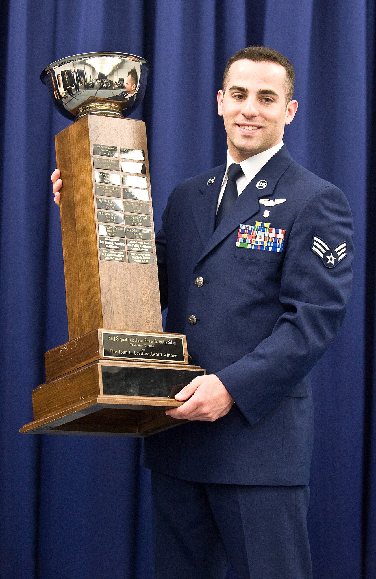 Senior Airman Kevin Siclari, 9th Airlift Squadron loadmaster, graduated Airman Leadership School May 5 and earned the John Levitow Award. The Levitow Honor Graduate Award is present to the top professional military education graduate from the ALS class. (U.S. Air Force photo/ Tom Randle)
