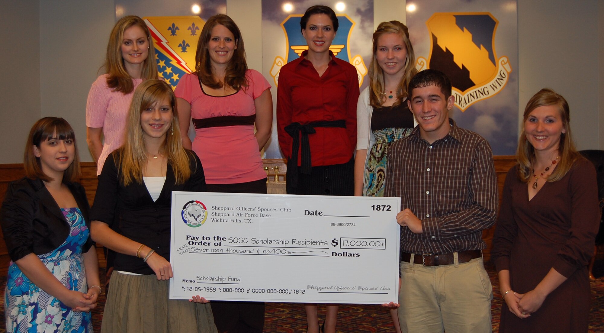 The Sheppard Officers’ Spouses’ Club awarded $18,500 to eight college scholarship recipients May 11th. The award winners are as follows; (front row left to right) Karyna Dillon, Marieke Van Gaalen, Brodie Bolen, Kathryn Schroeder, (back row left to right) Hannah Knauss, Janae Anderson, Olivia McCart and Alyssa Saville. The judging criterion for the high school awards was based on grade point average, community service and extracurricular activities and an essay.(U.S. Air Force photo/Sheppard Officer’s Spouses’ Club)
