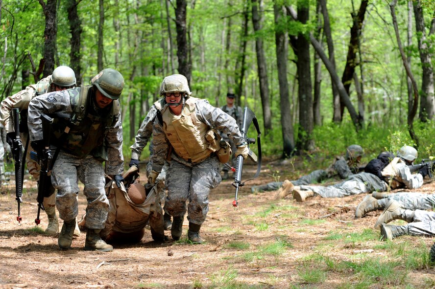 Student in the Advanced Contigingency Skills Training Course move a simulated victim during training on a Fort Dix, N.J. range on May 11, 2009.  The training taught by the  U.S. Air Force Expeditionary Center's 421st Combat Training Squadron on Fort Dix, prepares Airmen for upcoming deployments.   (U.S. Air Force Photo/Staff Sgt. Nathan G. Bevier) 