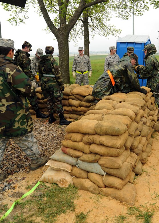 VOLK FIELD, Wisc.--Airmen from the 375th Airlift Wing work on building defensive fighting positions outside of their simulated work centers at Volk Field, Wisc., May 13. The Airmen from Scott, along with other Air National Guard and Air Force Reserve units, are at Volk Field for a week-long training mission. (U.S. Air Force photo/Airman 1st Class Wesley Farnsworth)