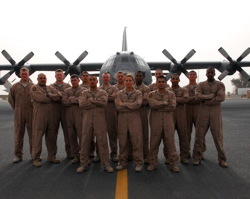 Members of the fly away security team in 386th Expeditionary Security Forces Squadron, Kuwait, primarily made of deployed Sheppard members, pose in front of a C-130. The FAST team provides ground security for aircraft landing when an airfield has limited ground security.(U.S. Air Force photo/ 386th ESFS)