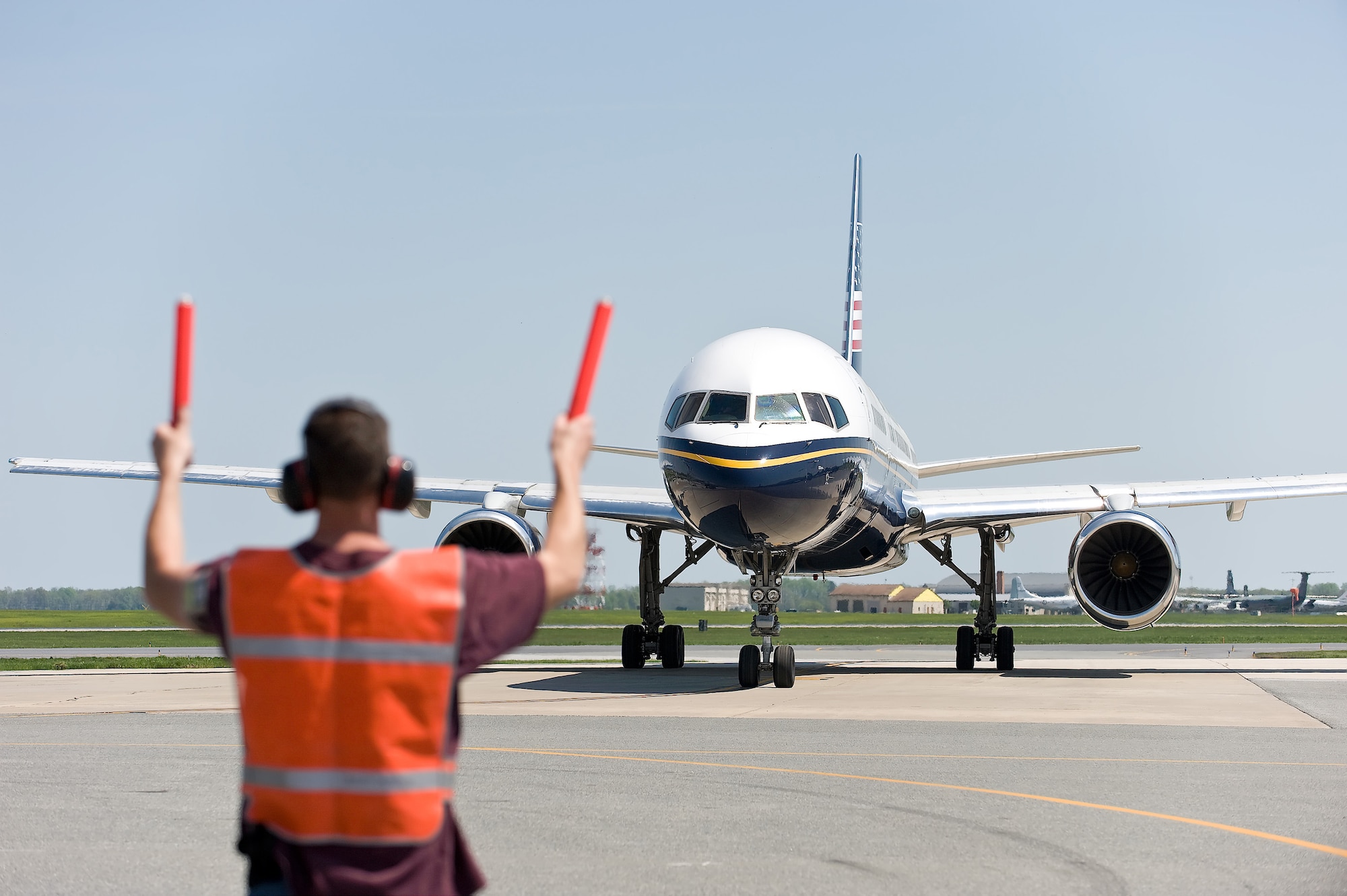 (RELEASED)Todd Hilliker, 436th Aircraft Maintenance Squadron Transient Maintenance Flight, guides a transient aircraft to the runway at Dover Air Force Base April 26. Transient maintenance recovers, services and launches non-Dover assigned aircraft that transit Dover AFB. (U.S. Air Force Photo/Roland Balik)