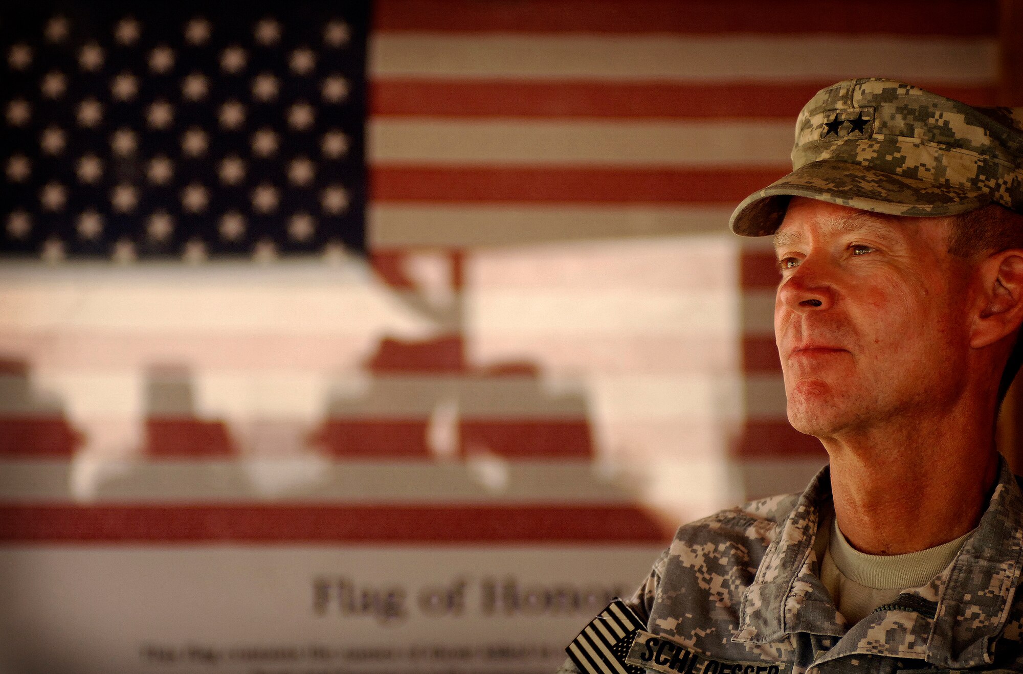 BAGRAM AIR FIELD, Afghanistan -- Army Maj. Gen. Jeffrey Schloesser, International Security Assistance Force Regional Commander East and senior leader at Bagram Air Field, thanks 455th Air Expeditionary Wing Airmen for their contributions during his tenure here. The two-star general, who plans to return home soon, recognized the efforts of 10 Airmen and presented them with his honorary military coin. The Airmen of the 455th AEW provide close air support and combat search and rescue capabilities for coalition ground troops in addition to aeromedical evacuations, perimeter defense and expertise in a variety of specialized jobs throughout the theater of operations. (Air Force/Staff Sgt. Jason Lake)