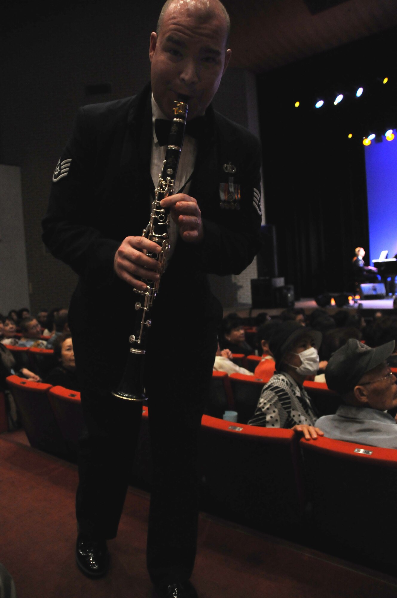 OME, Japan -- Staff Sgt. Jeff Hall, U. S. Air Force Band of the Pacific, performs for the citizens of Ome during a concert at the city's auditorium May 13. Final Approach, a protocol combo band from Yokota and the Greatlanders, a 15-piece popular music combo from the Band of the Pacific at Elmendorf Air Force Base, Alaska, have joined forces for a tour of Japan May 6-17. The newly formed Ome-Yokota Friendship Club sponsored the concert. (U.S. Air Force photo/Tech. Sgt. Kimberly Spinner)