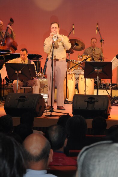 OME, Japan -- Staff Sgt.Tom Salyers, U. S. Air Force Band of the Pacific, performs for the citizens of Ome during a concert at the city's auditorium May 13. Final Approach, a protocol combo band from Yokota and the Greatlanders, a 15-piece popular music combo from the U.S. Air Force Band of the Pacific at Elmendorf Air Force Base, Alaska, have joined forces for a tour of Japan May 6-17. The newly formed Ome-Yokota Friendship Club sponsored the concert. (U.S. Air Force photo/Tech. Sgt. Kimberly Spinner)