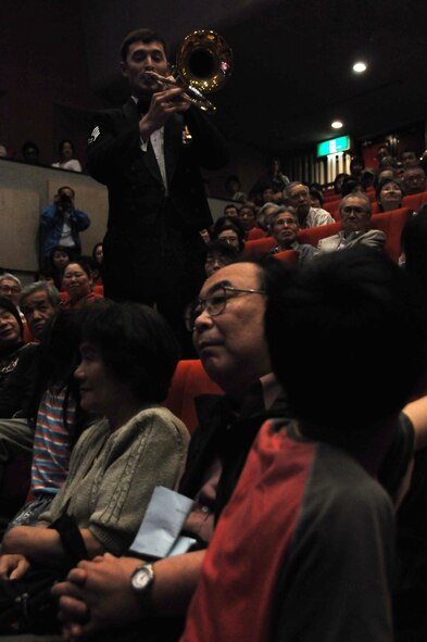 OME, Japan -- Staff Sgt. Dave McCormick, U. S. Air Force Band of the Pacific, performs for the citizens of Ome during a concert at the city's auditorium May 13. Final Approach, a protocol combo band from Yokota and the Greatlanders, a 15-piece popular music combo from the U.S. Air Force Band of the Pacific at Elmendorf Air Force Base, Alaska, have joined forces for a tour of Japan May 6-17. The newly formed Ome-Yokota Friendship Club sponsored the concert. (U.S. Air Force photo/Tech. Sgt. Kimberly Spinner)