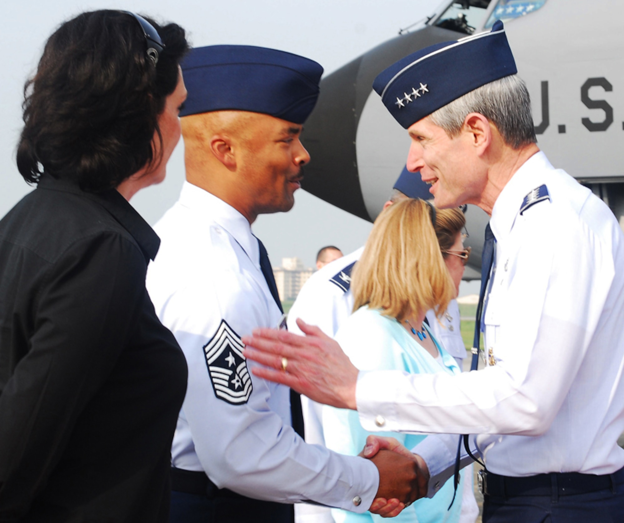 YOKOTA AIR BASE, Japan -- General Norton Schwartz, Air Force chief of staff, shakes hands with Chief Master Sgt. Linus Jordan, 374th Airlift Wing command chief master sergeant, and his wife Vonda, May 11 after arriving on the general's first visit here since becoming chief of staff Aug. 12, 2008. General Schwartz will meet with key U.S. and Japanese military leaders as well as local Japanese community leaders
during his visit. He will also tour several base facilities and conduct an Airmen's Call during his brief visit. (U.S. Air Force photo/Airman Sean Martin)
