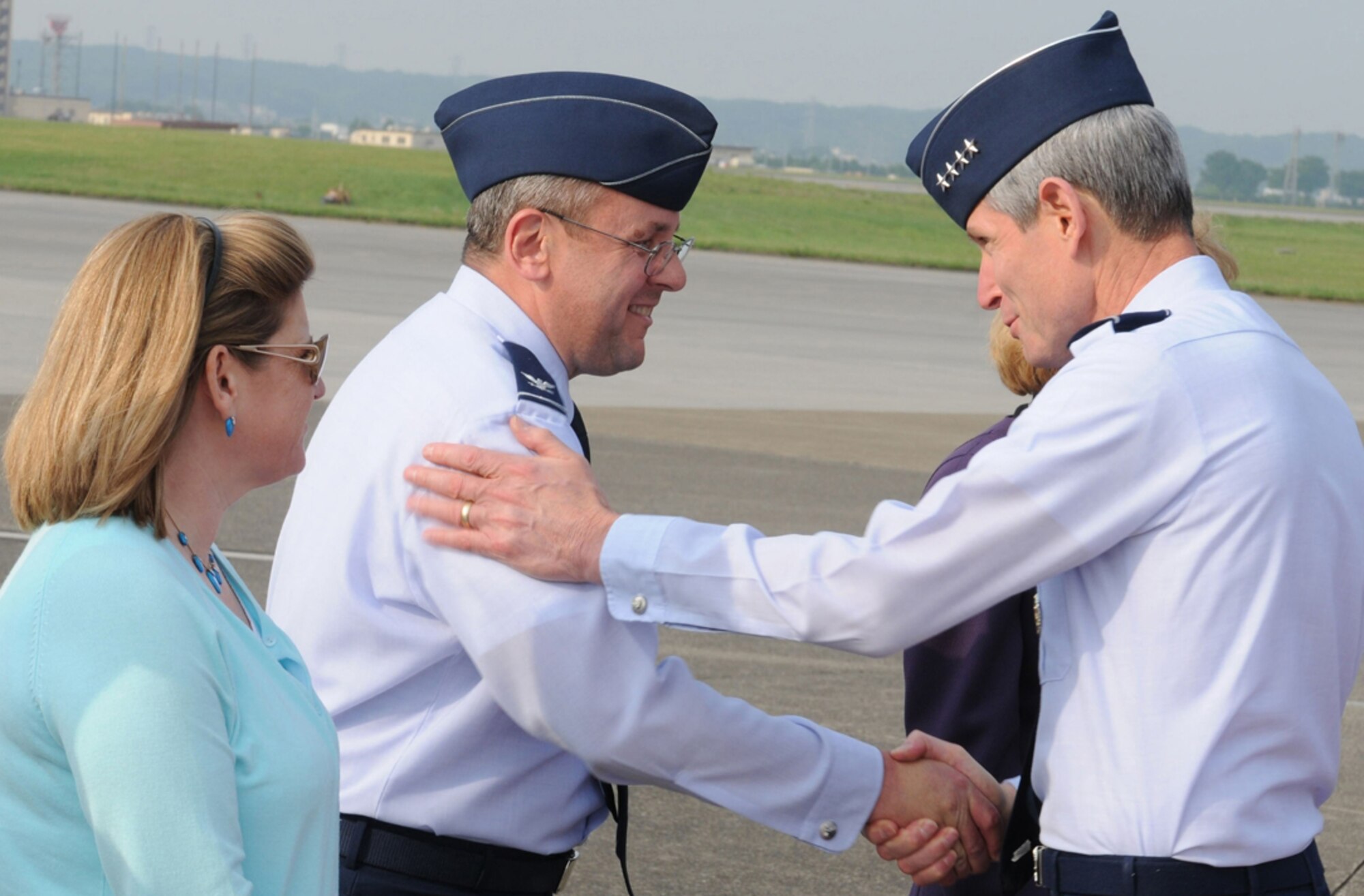 YOKOTA AIR BASE, Japan -- General Norton Schwartz, Air Force chief of staff,
shakes hands with Col. Frank Eppich, 374th Airlift Wing vice commander, and his wife Anita, May 11 after arriving on the general's first visit here since
becoming chief of staff Aug. 12, 2008. General Schwartz will meet with key U.S.
and Japanese military leaders as well as local Japanese community leaders
during his visit. He will also tour several base facilities and conduct an
Airmen's Call during his brief visit. (U.S. Air Force photo/Airman 1st Class Devin Doskey)
