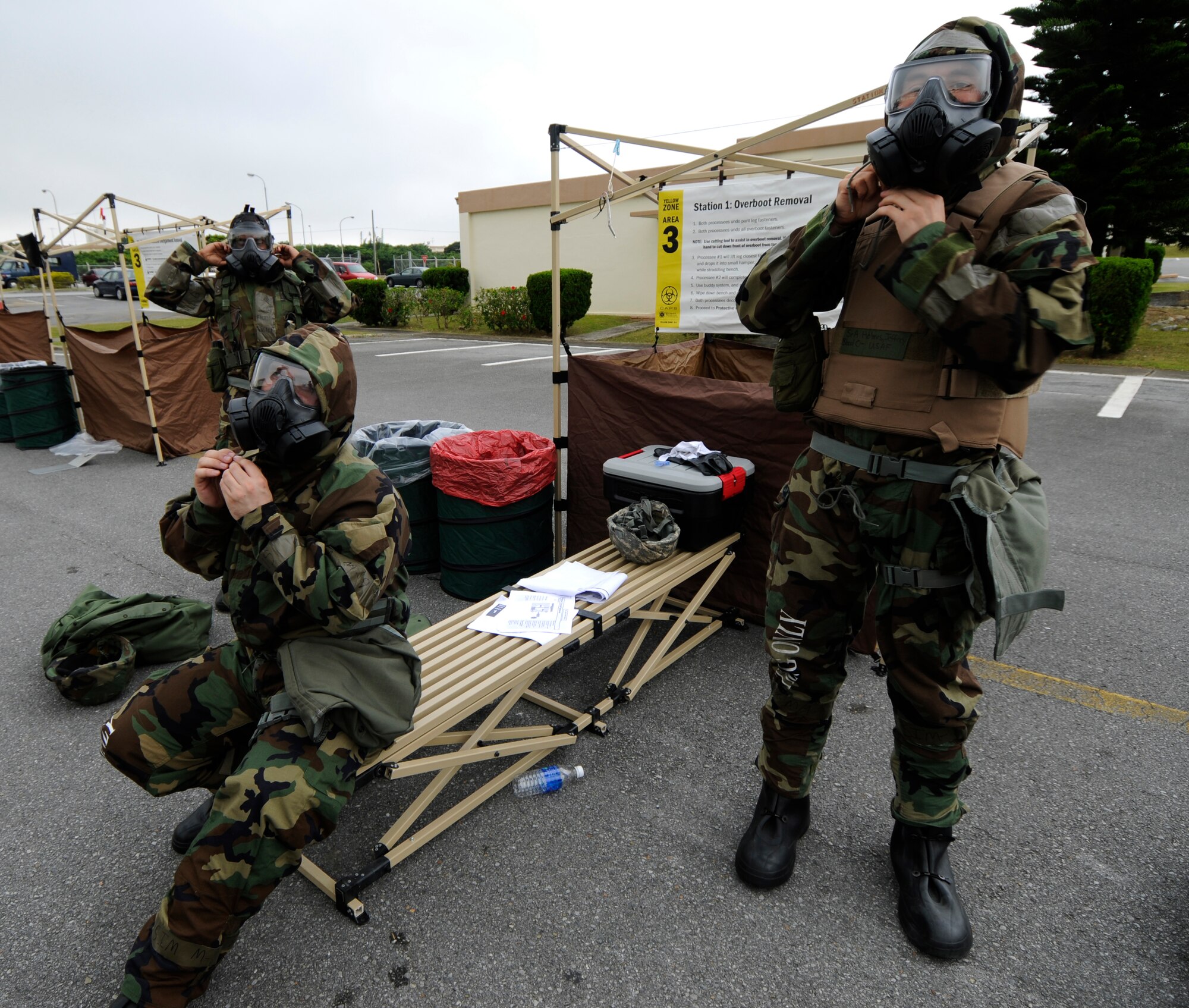 Airmen assigned to the 18th Operations Support Squadron don their protective gear during  Beverly High 09-2 Local Operational Readiness Exercise May 13. The LORE tests base personnel on their combat readiness for real world emergency/combat events.   (U.S. Air Force photo/Airman 1st Class Chad Warren)
